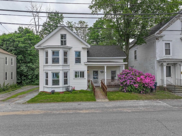5 School St, Tilton, NH 03276 - view of front of house with covered porch and a shingled roof