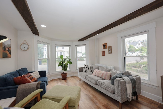 5 School St, Tilton, NH 03276 - living area with beamed ceiling, healthy amount of natural light, light wood-style floors, and recessed lighting