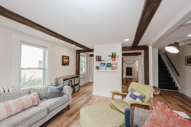 5 School St, Tilton, NH 03276 - living area with stairs, beam ceiling, light wood-style floors, radiator, and recessed lighting