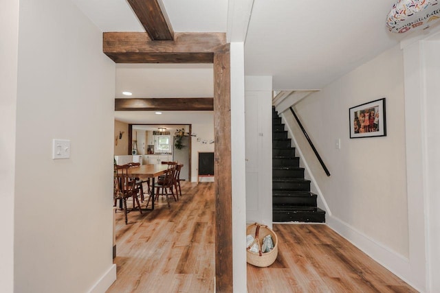 5 School St, Tilton, NH 03276 - staircase with wood finished floors, beam ceiling, and recessed lighting