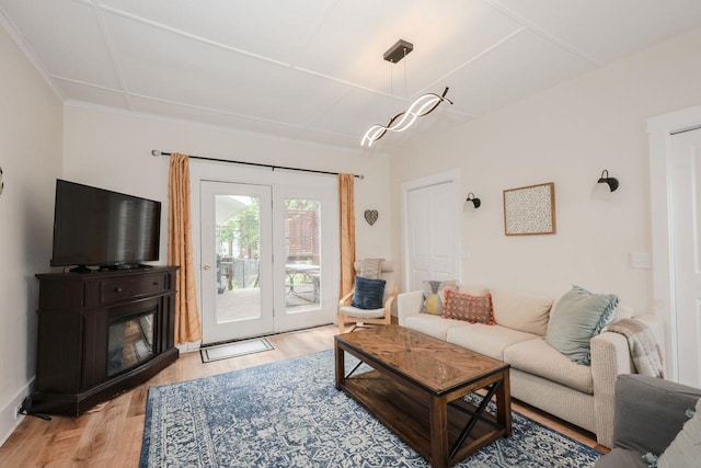 5 School St, Tilton, NH 03276 - living room with light wood-style floors and a glass covered fireplace