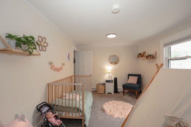 5 School St, Tilton, NH 03276 - carpeted bedroom with ornamental molding and a crib