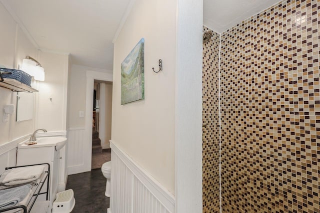 5 School St, Tilton, NH 03276 - full bathroom featuring vanity, a shower stall, wainscoting, a decorative wall, and crown molding