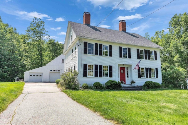 121 Main St, New Ipswich, NH 03071 - colonial inspired home with a chimney, a front lawn, a detached garage, and a shingled roof