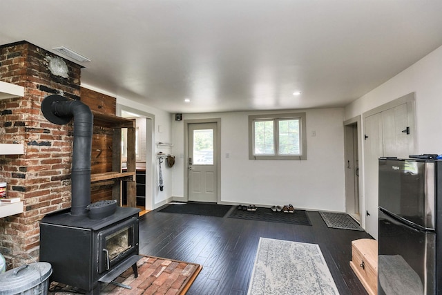 121 Main St, New Ipswich, NH 03071 - foyer featuring a wood stove, hardwood / wood-style flooring, and recessed lighting