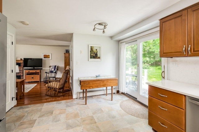 1 Constable Rd, Durham, NH 03824 - kitchen with a baseboard heating unit, dishwasher, light countertops, and brown cabinetry