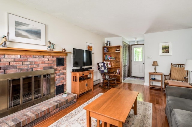 1 Constable Rd, Durham, NH 03824 - living area featuring baseboard heating, wood finished floors, and a fireplace