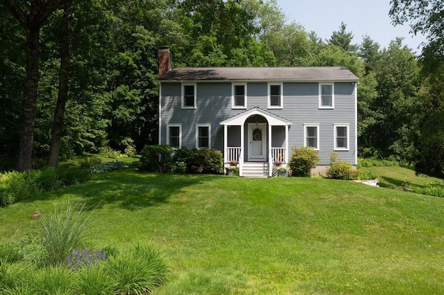 1 Constable Rd, Durham, NH 03824 - colonial-style house featuring a chimney and a front yard