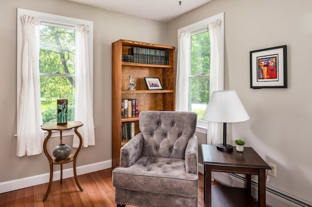 1 Constable Rd, Durham, NH 03824 - living area with wood finished floors and a baseboard radiator