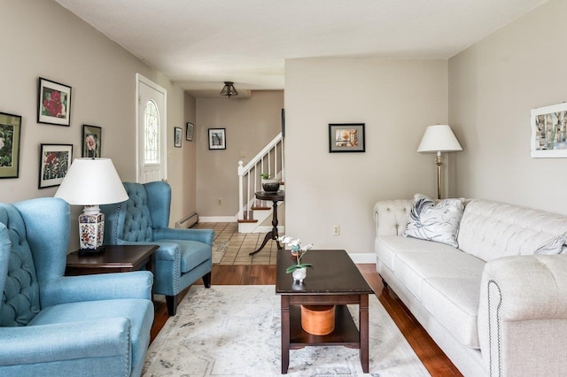 1 Constable Rd, Durham, NH 03824 - living area with wood finished floors, stairs, and a baseboard heating unit