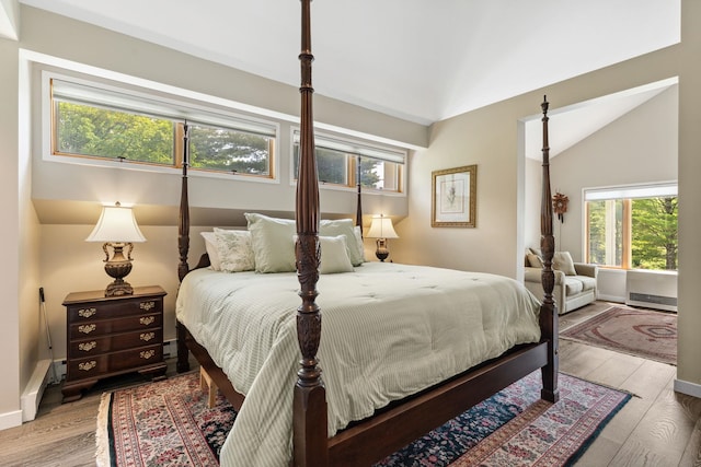 149 Club Sugarbush N Rd, Warren, VT 05674 - bedroom featuring wood finished floors, lofted ceiling, and baseboard heating