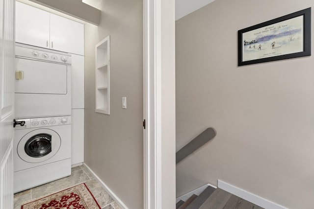 149 Club Sugarbush N Rd, Warren, VT 05674 - laundry room with stacked washer and clothes dryer and baseboards