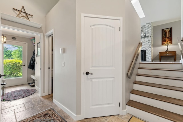 149 Club Sugarbush N Rd, Warren, VT 05674 - stairs featuring stone tile floors and a skylight