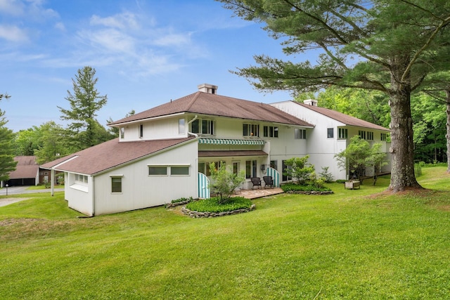 149 Club Sugarbush N Rd, Warren, VT 05674 - back of property featuring a lawn, a shingled roof, and a patio area