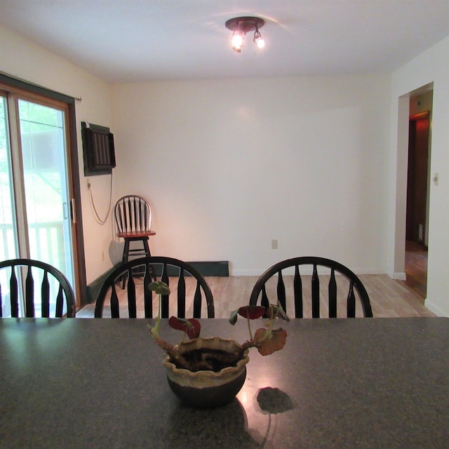 129 Chestnut St, Claremont, NH 03743 - dining space featuring light wood-style floors and an AC wall unit