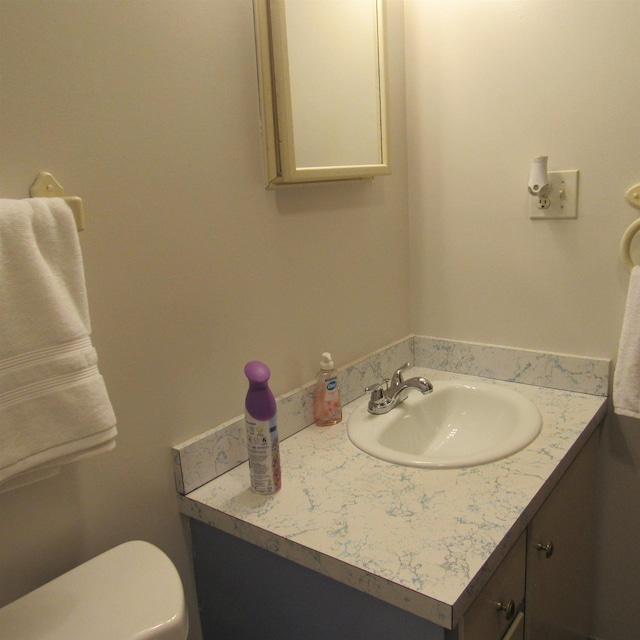 129 Chestnut St, Claremont, NH 03743 - half bath featuring vanity and toilet