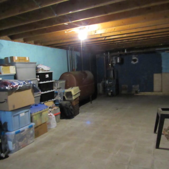 129 Chestnut St, Claremont, NH 03743 - unfinished below grade area with oil tank and a heating unit