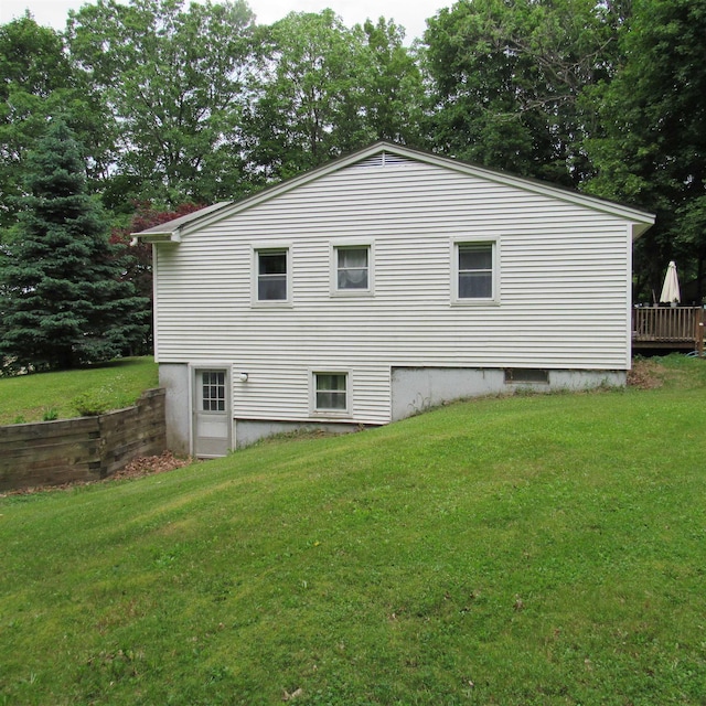 129 Chestnut St, Claremont, NH 03743 - view of home's exterior with a yard and view of wooded area