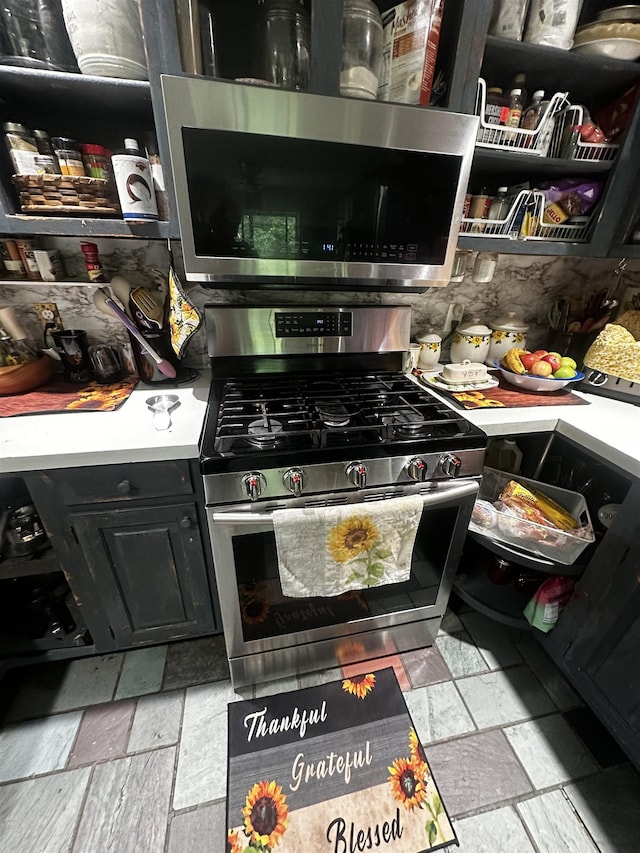 74 Dutton District Rd, Springfield, VT 05156 - kitchen with appliances with stainless steel finishes, light countertops, and dark cabinetry