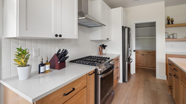 3148 Mountain Rd Unit B, Stowe, VT 05672 - kitchen with stainless steel appliances, wall chimney range hood, light wood-type flooring, open shelves, and tasteful backsplash