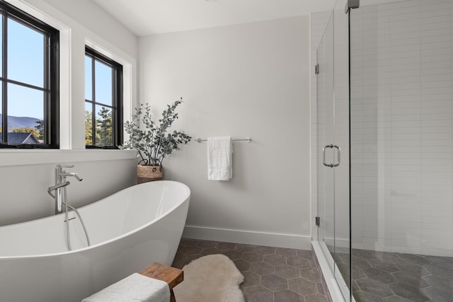 3148 Mountain Rd Unit B, Stowe, VT 05672 - bathroom with a shower stall, a soaking tub, and tile patterned flooring