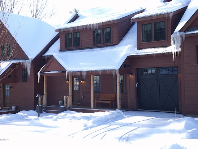 3148 Mountain Rd Unit B, Stowe, VT 05672 - rustic home with a garage and covered porch