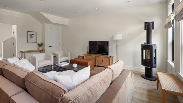 3148 Mountain Rd Unit B, Stowe, VT 05672 - living area featuring light wood-style floors, recessed lighting, and a wood stove
