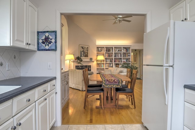 53 Summit Ridge Dr, Keene, NH 03431 - dining area with a ceiling fan, light wood-style flooring, and lofted ceiling