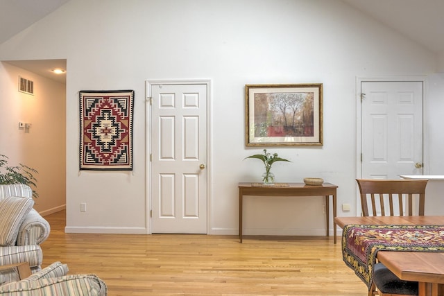 53 Summit Ridge Dr, Keene, NH 03431 - living area featuring high vaulted ceiling and light wood-style flooring