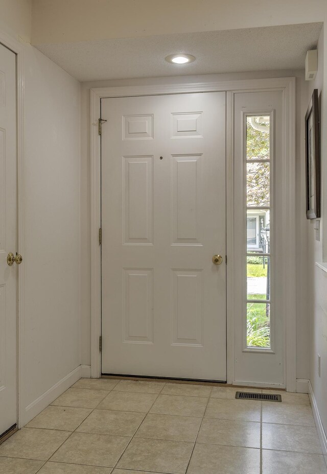 53 Summit Ridge Dr, Keene, NH 03431 - doorway to outside with light tile patterned floors and plenty of natural light