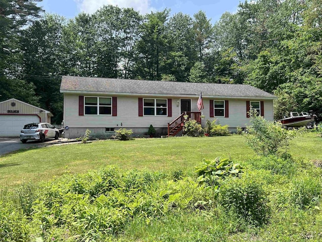 30 Winter Rd, Hillsborough, NH 03244 - view of front of property with a detached garage, a front lawn, and an outbuilding