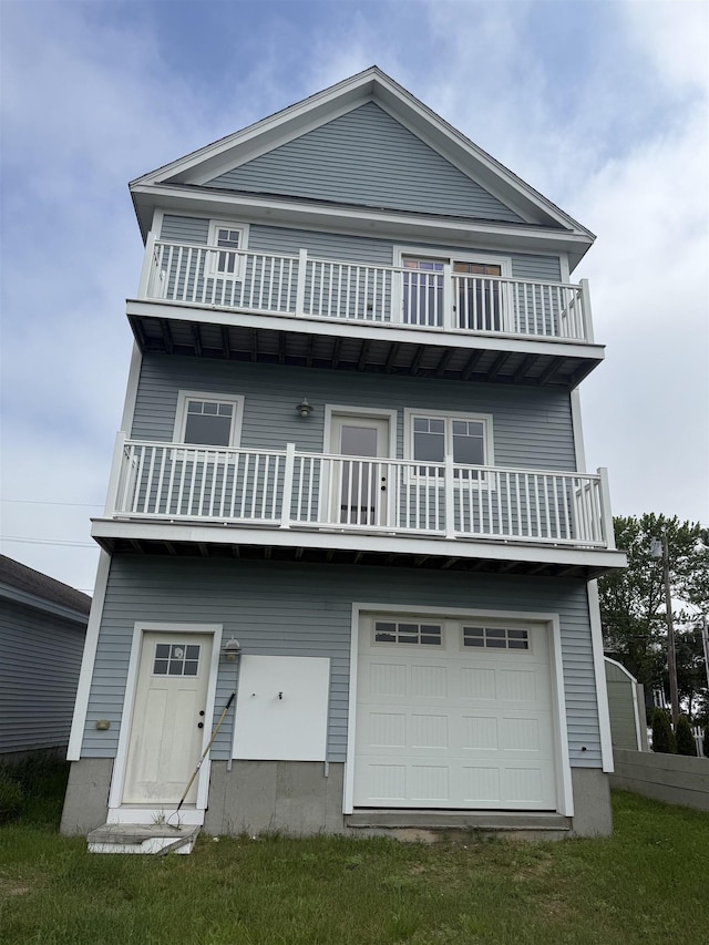 30 River St, Seabrook, NH 03874 - view of front of property with a balcony and an attached garage