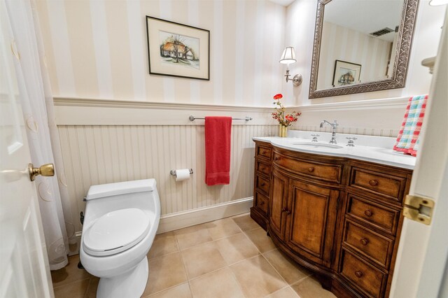5 Melendy Holw, Amherst, NH 03031 - bathroom featuring a wainscoted wall, vanity, tile patterned flooring, and wallpapered walls