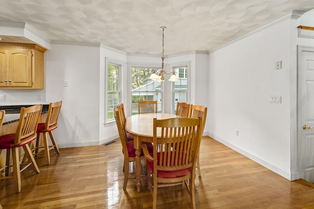 8 Aulson Rd, Salem, NH 03079 - dining space featuring light wood-style flooring, a chandelier, and crown molding