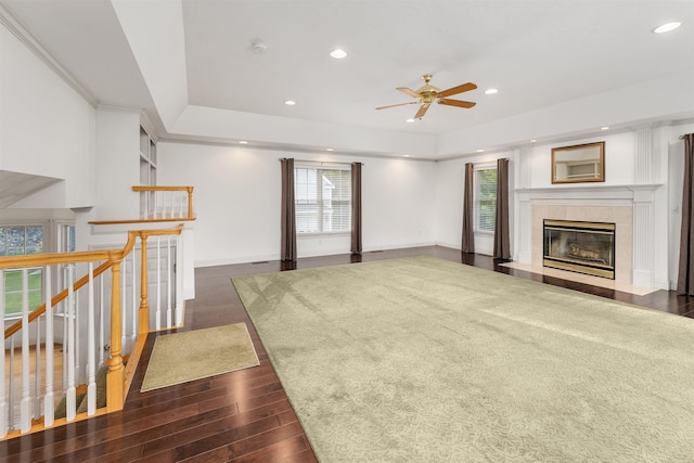 8 Aulson Rd, Salem, NH 03079 - unfurnished living room with a ceiling fan, dark wood-type flooring, recessed lighting, a raised ceiling, and a tile fireplace