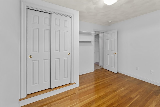 8 Aulson Rd, Salem, NH 03079 - unfurnished bedroom with light wood finished floors and a closet