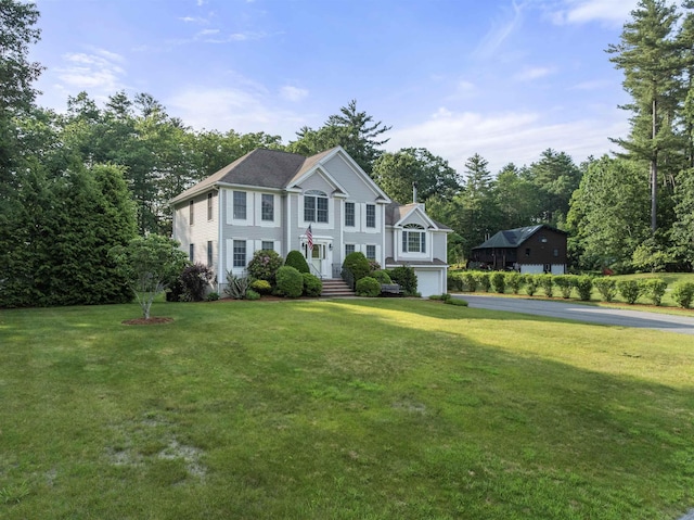 8 Aulson Rd, Salem, NH 03079 - colonial inspired home with asphalt driveway, a garage, and a front lawn