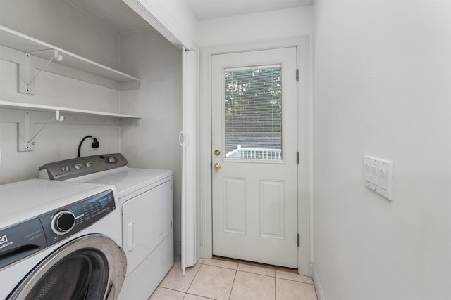 8 Aulson Rd, Salem, NH 03079 - laundry area with washing machine and clothes dryer and light tile patterned floors