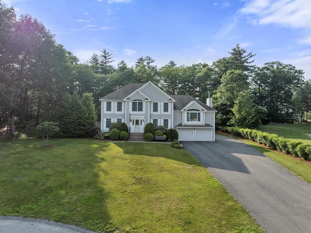 8 Aulson Rd, Salem, NH 03079 - colonial inspired home featuring a chimney, an attached garage, asphalt driveway, and a front yard
