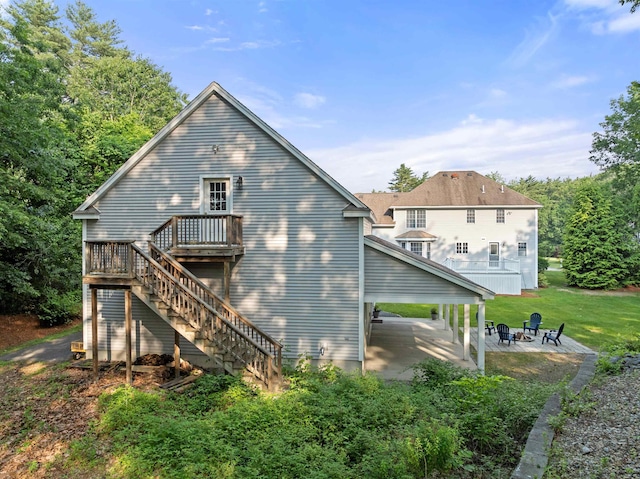 8 Aulson Rd, Salem, NH 03079 - back of house with a fire pit, a patio area, stairway, a wooden deck, and a yard
