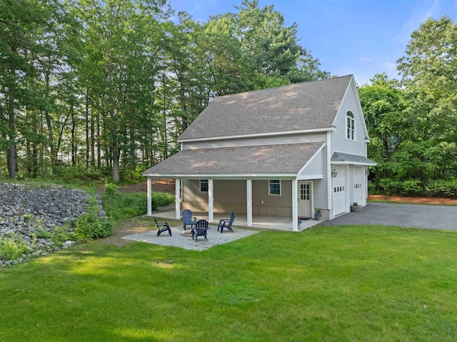 8 Aulson Rd, Salem, NH 03079 - rear view of property with asphalt driveway, roof with shingles, a yard, and a patio area