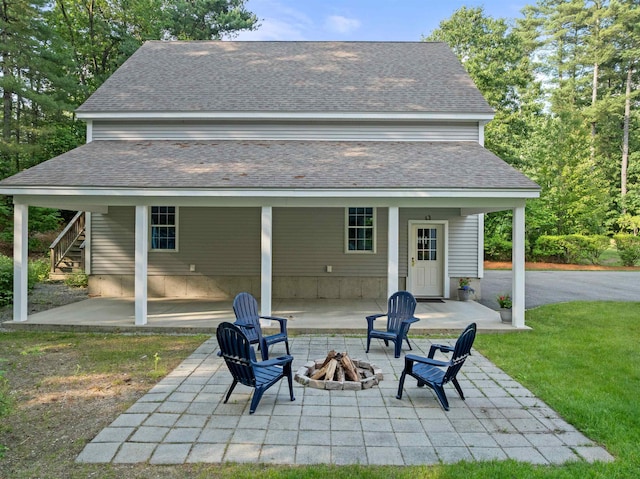 8 Aulson Rd, Salem, NH 03079 - rear view of house with an outdoor fire pit, roof with shingles, stairs, and a patio