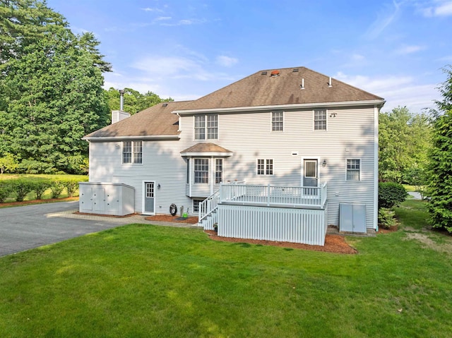 8 Aulson Rd, Salem, NH 03079 - rear view of house featuring a deck, a chimney, and a yard
