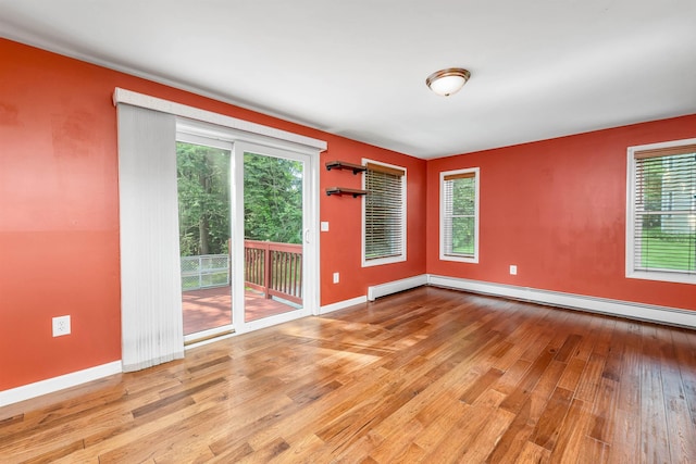 31 Bluffs Dr, Concord, NH 03303 - spare room with wood-type flooring and a baseboard heating unit