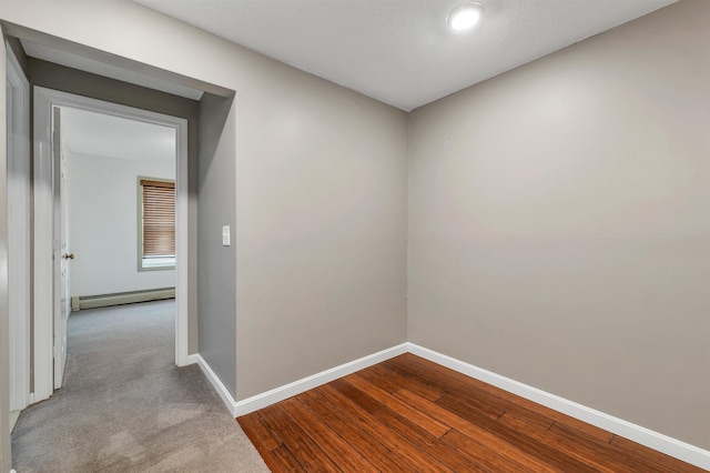 31 Bluffs Dr, Concord, NH 03303 - corridor featuring baseboard heating, dark wood-style floors, and recessed lighting