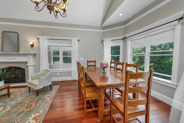 85 Blueberry Hill Rd, Meredith, NH 03253 - dining space featuring hardwood / wood-style floors, a chandelier, lofted ceiling, a fireplace, and recessed lighting