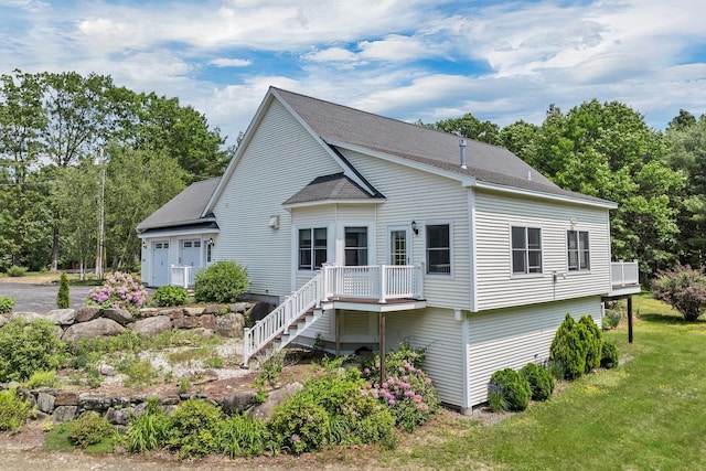 85 Blueberry Hill Rd, Meredith, NH 03253 - rear view of house featuring a yard, a wooden deck, stairs, and roof with shingles