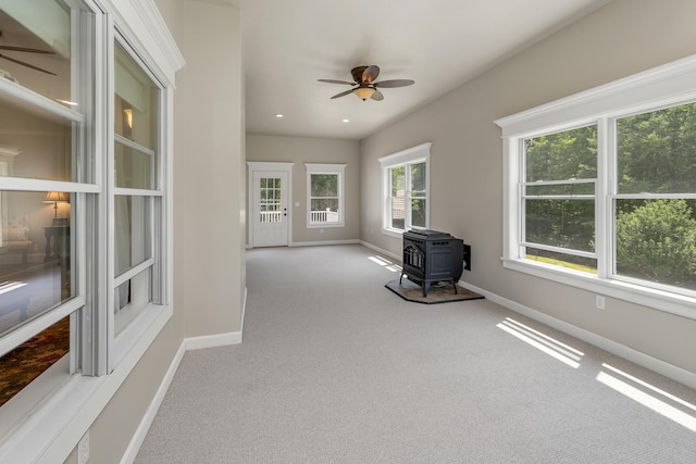 85 Blueberry Hill Rd, Meredith, NH 03253 - unfurnished sunroom with a wood stove