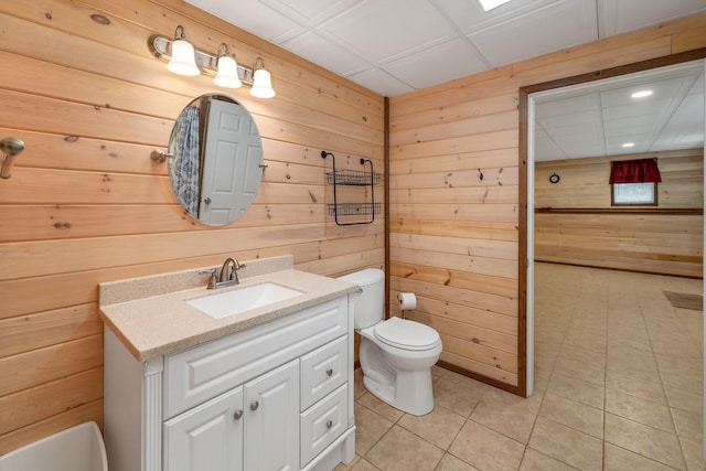 85 Blueberry Hill Rd, Meredith, NH 03253 - bathroom featuring wood walls, vanity, and tile patterned floors