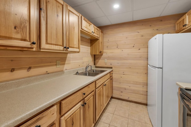 85 Blueberry Hill Rd, Meredith, NH 03253 - kitchen featuring freestanding refrigerator, wooden walls, light tile patterned floors, light countertops, and stainless steel range oven